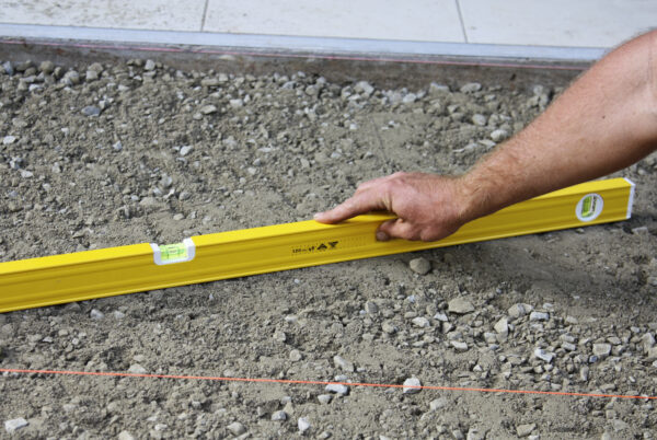 preparing and leveling the ground for paving
