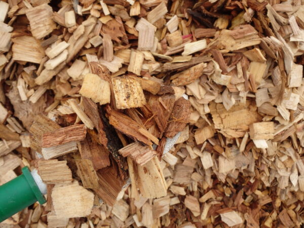 Wood chips piled together neatly.