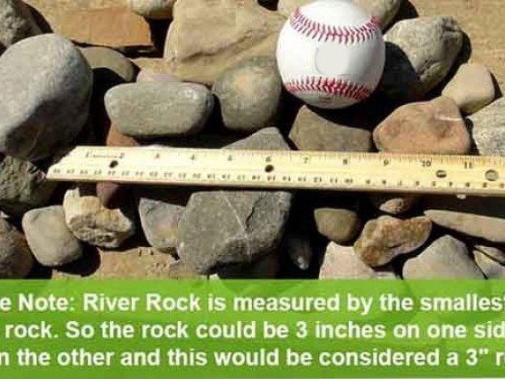Measuring 1-3 inch decorative river rock with a baseball and ruler