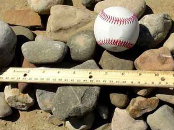 1-3 inch decorative river rock with a baseball and ruler for size