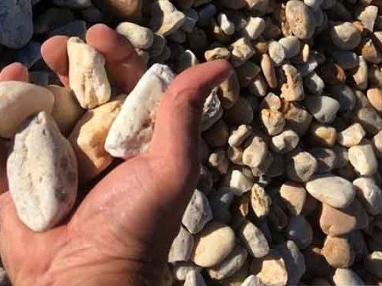 2 inch river wash gravel held in a hand, delivered in MD and VA