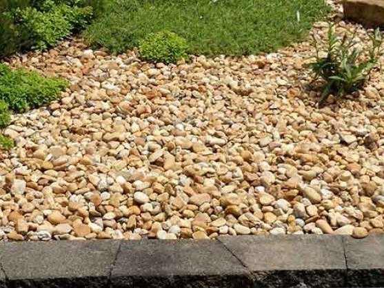 2 inch river wash gravel in a landscape bed