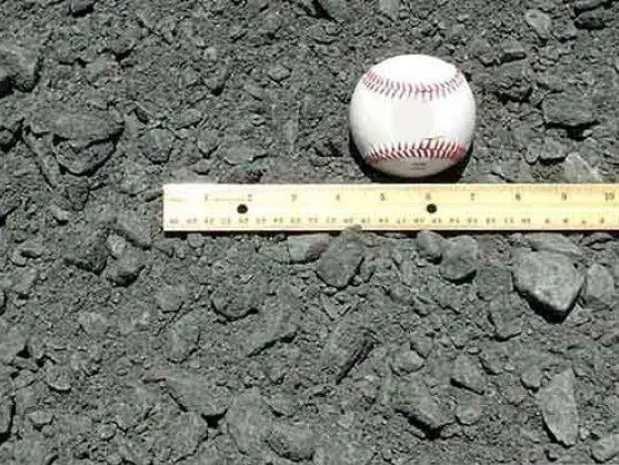Crush and run gravel with a baseball and ruler for size