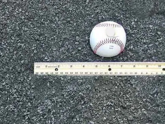 Stone dust with a baseball and ruler for size, delivered in MD and VA