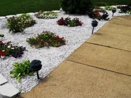 White 3/4 inch gravel landscaping along a walkway, delivered in MD and VA